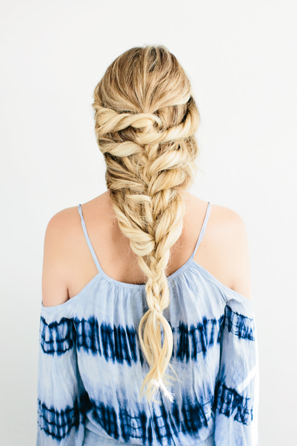 Dash of Darling shares an easy hair tutorial for a romantic mermaid twisted braid tutorial.