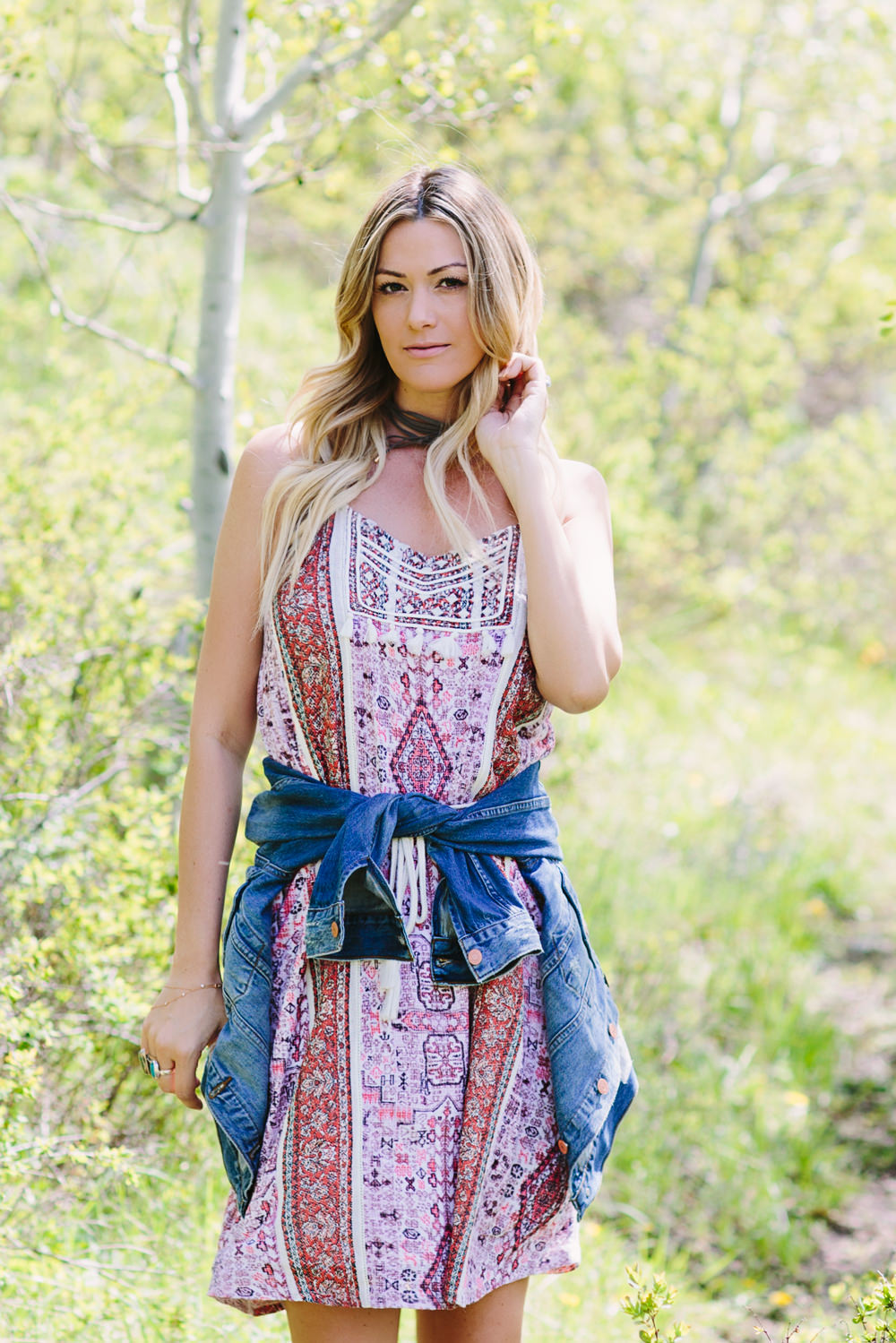 Dash of Darling styles a Lucky printed cotton dress with a denim jacket for summer.