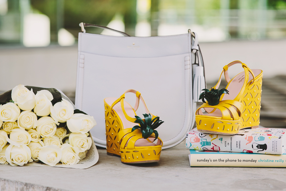 Dash of Darling styles kate spade yellow pineapple wedges white a white cross body bag.