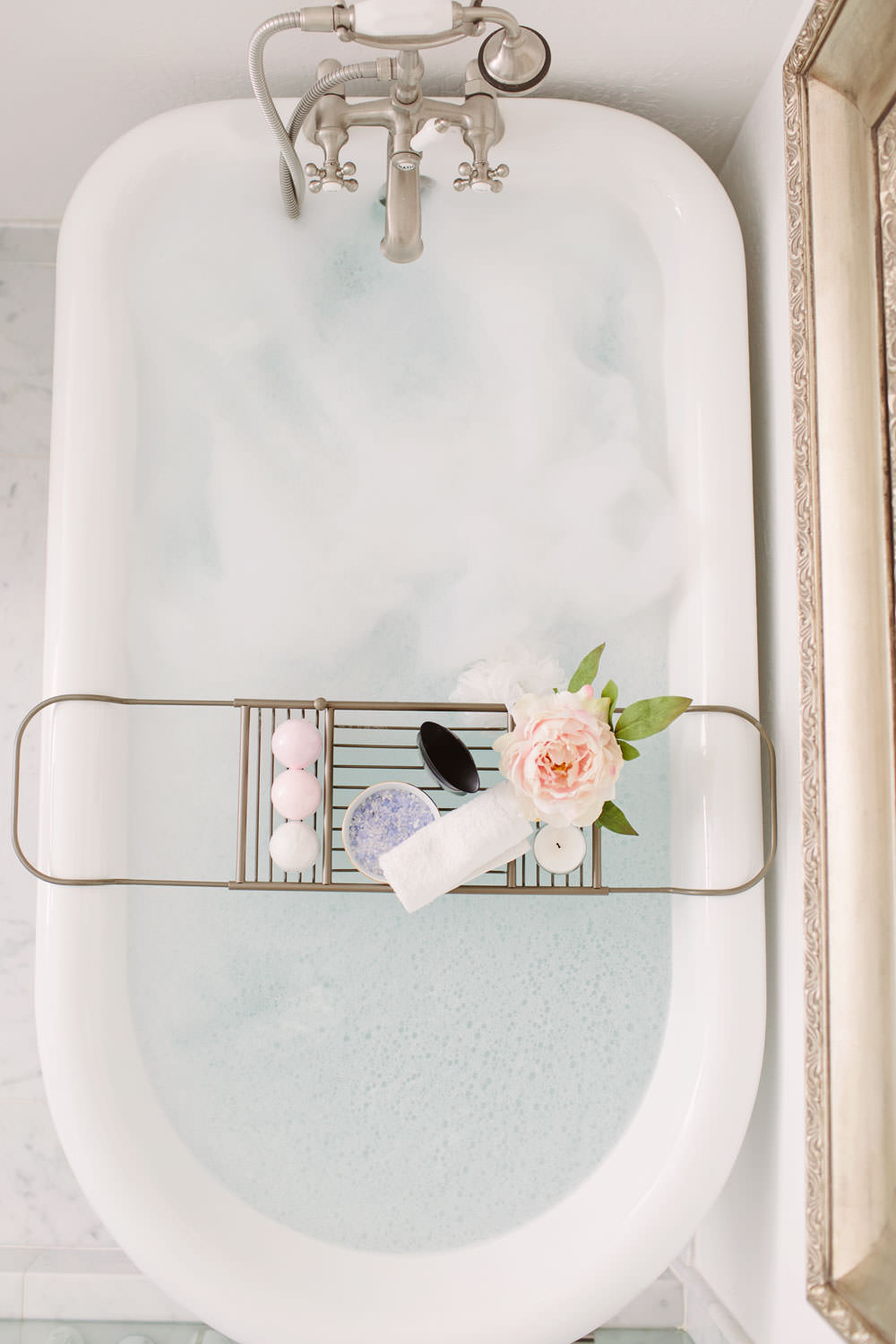 Caress fine fragrances lavender scented body wash in the bath with a bathtub caddy