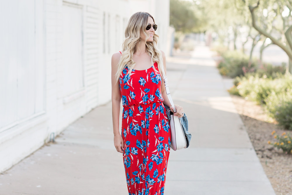 Dash of Darling styles a Cece Sportswear Red and Blue floral Maxi Dress with a white kate spade bag and Joie sandals for summer.