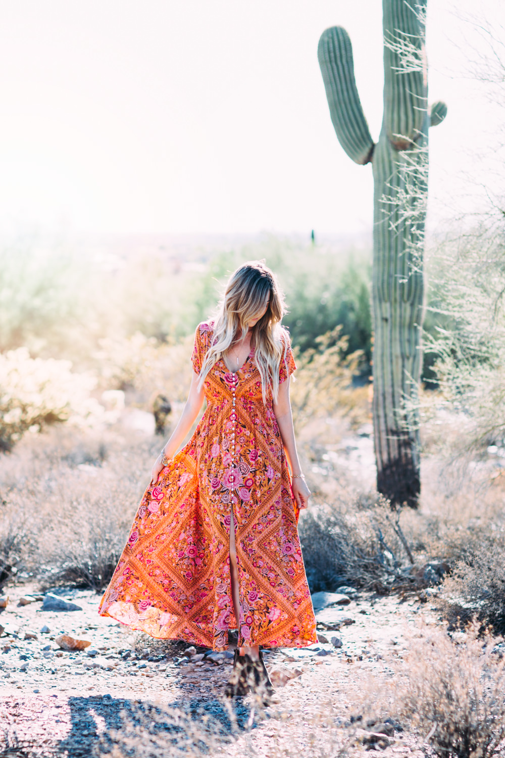 Dash of Darling styles a bohemian vintage floral print button-front maxi dress in the Arizona desert for a simple summer look.