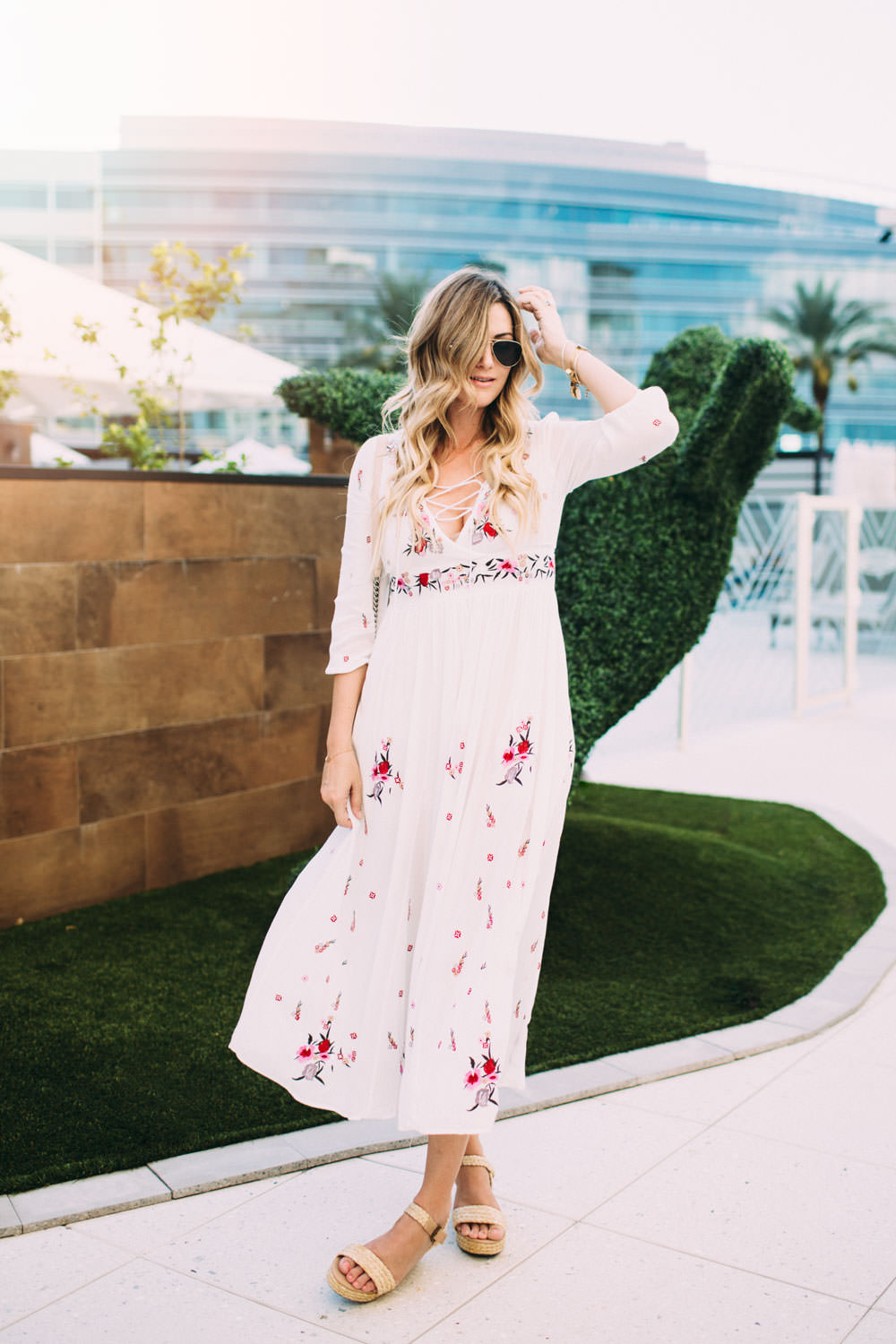 Dash of Darling wears a bohemian Chicwish white floral maxi dress and Loft wedge sandals during her staycation at the Camby Hotel in Pheonix, Arizona.