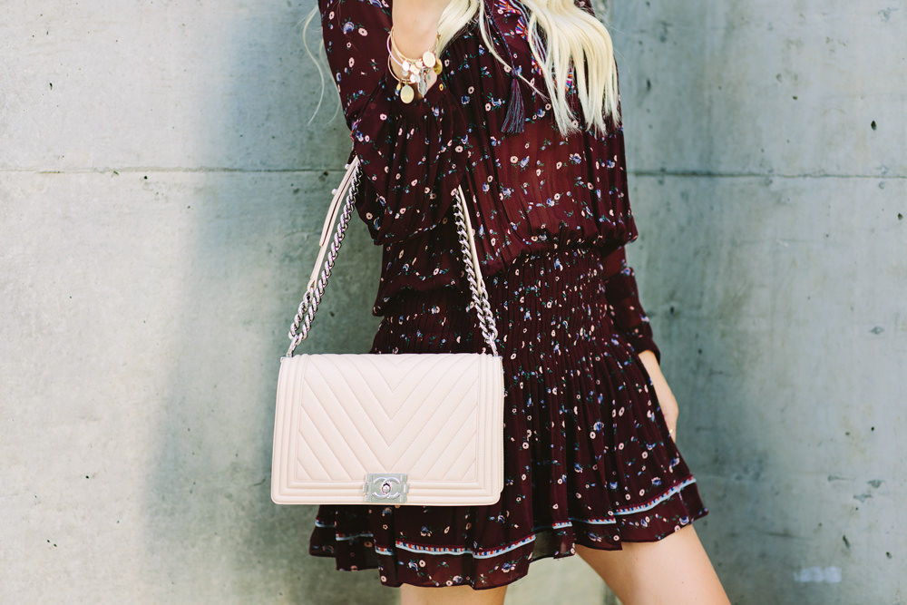 Caitlin Lindquist of the Arizona fashion blog styles an Ulla Johnson sheer floral mini dress with a Rag and Chanel chevron boy bag.