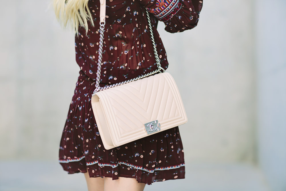 Caitlin Lindquist of the Arizona fashion blog styles an Ulla Johnson sheer floral mini dress with a Rag and Chanel chevron boy bag.