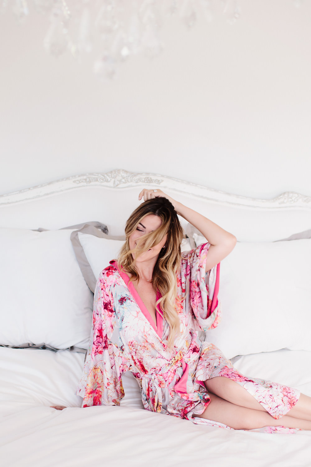 Dash of Darling lounges at home in her Natori satin floral robe from Her Room.