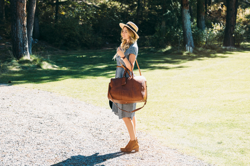Dash of Darling styles a J.Crew gingham dress with a Sole Society duffle bag, cross body tote and booties for a Fall outfit while traveling to Missoula Montana. 