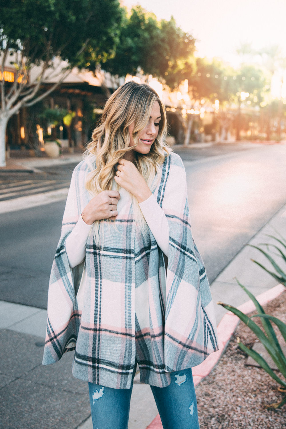 Dash of Darling styles a blush pink plaid cape by Ted Baker with denim jeans and bow heels for a Fall outfit.