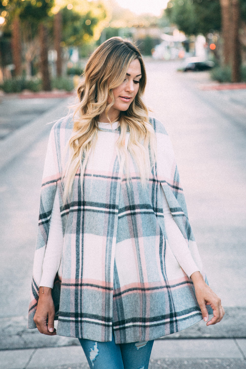 Dash of Darling styles a blush pink plaid cape by Ted Baker with denim jeans and bow heels for a Fall outfit.