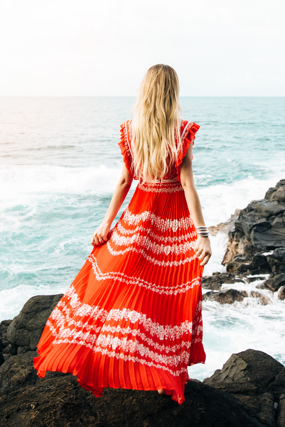 Dash of Darling wears a red Self Portrait maxi dress at Queens bath in Kauai, Hawaii while staying at the St. Regis Princeville Resort.