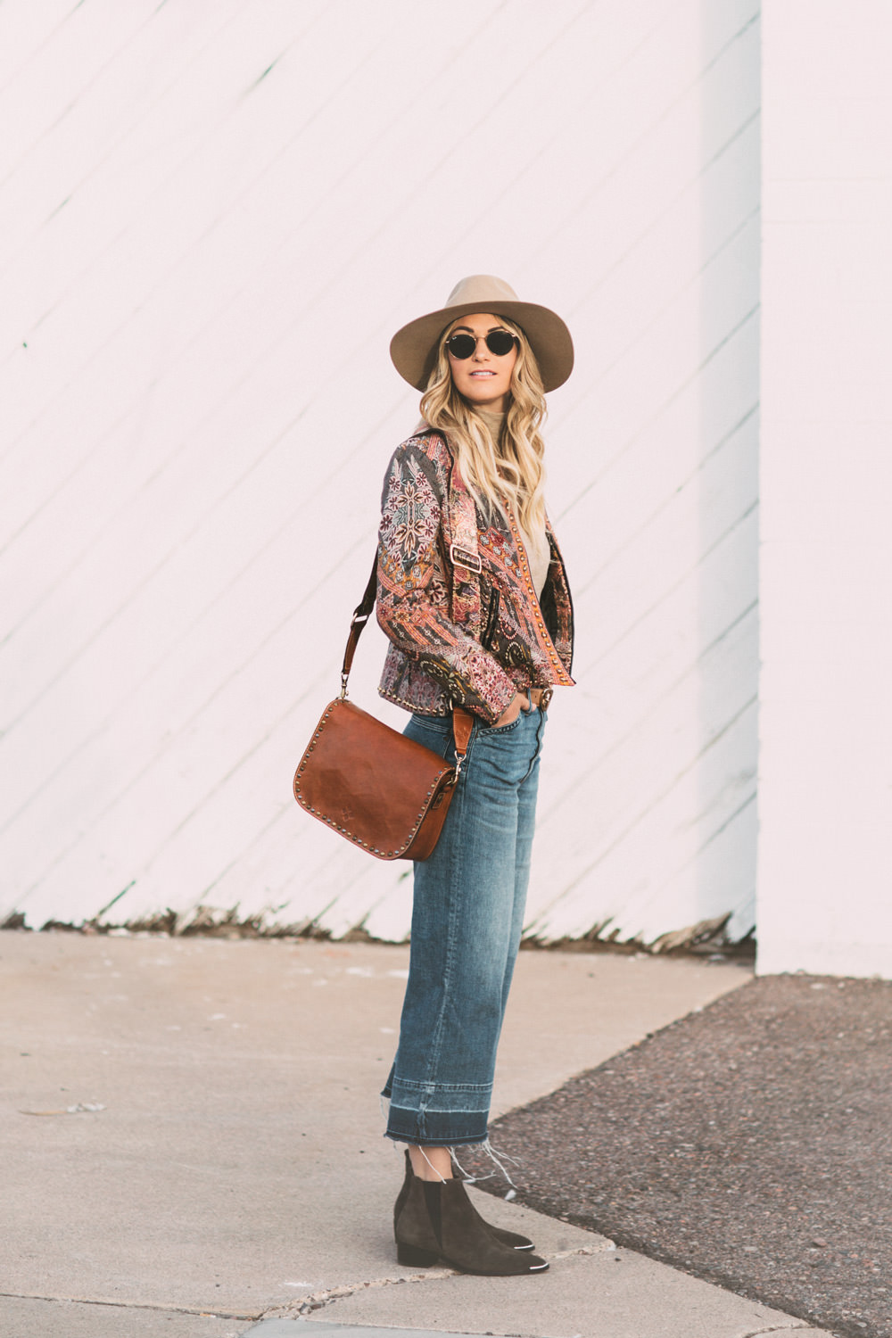 Caitlin Lindquist of the Arizona fashion blog Dash of Darling shares a spring outfit with Macy's wearing a Patricia Nash bag with Madewell cropped denim and an Anthropologie jacket.