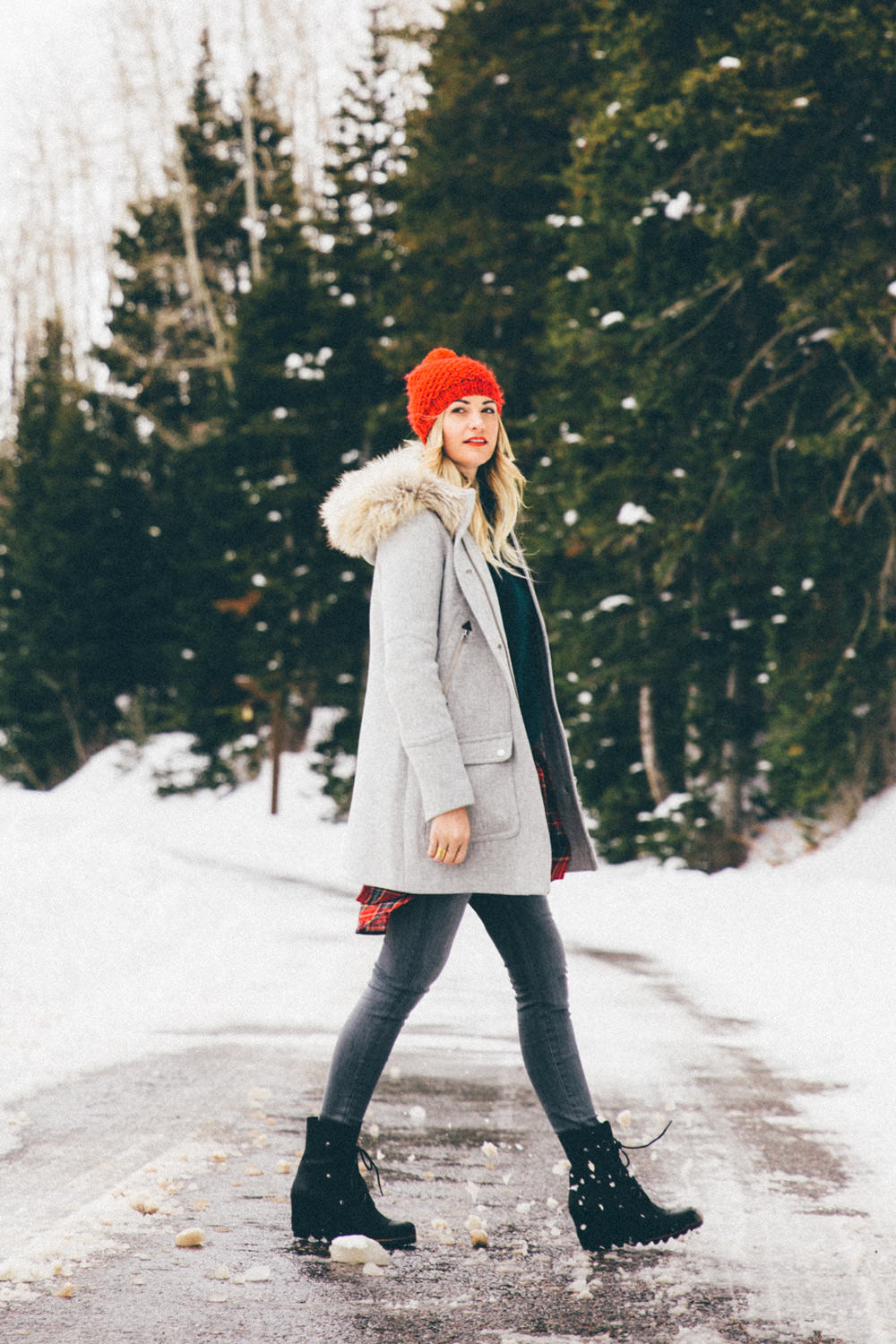 Dash of Darling wears a winter outfit in the snow while visiting home in Park City, Utah