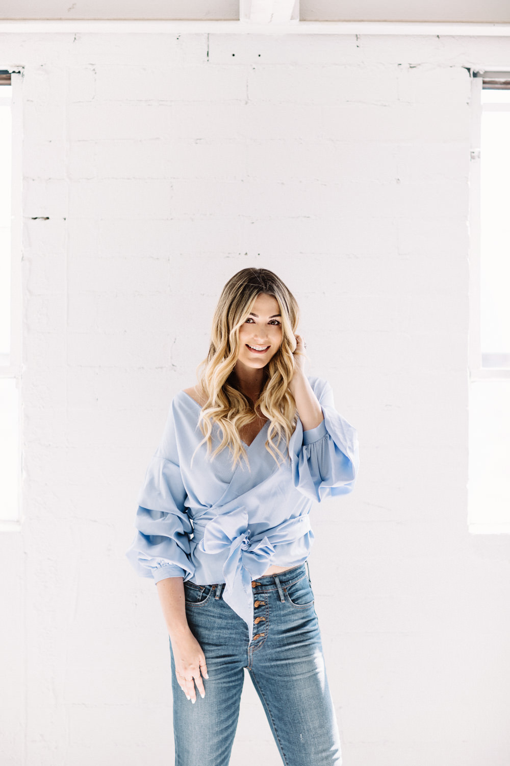 Caitlin Lindquist of Dash of Darling wears a One by Stylekeppers gingham wrap top with Madewell high rise denim in a personal blog post about being free.