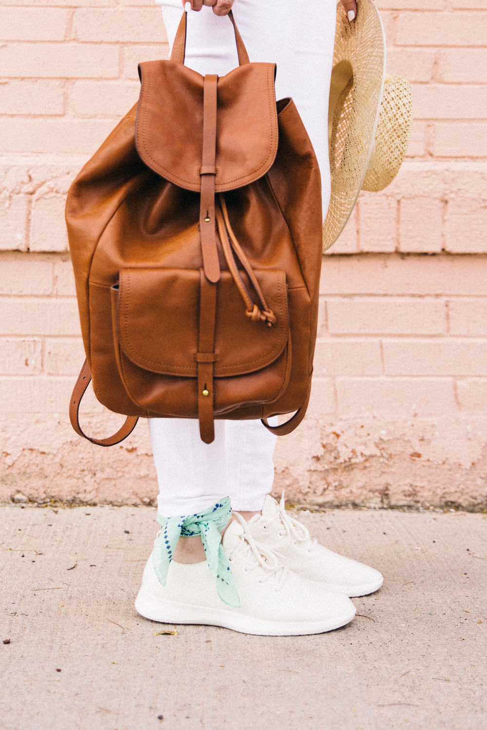 Caitlin Lindquist of Dash of Darling shares an all white outfit for Spring with AllBirds wool runners and white madewell denim.
