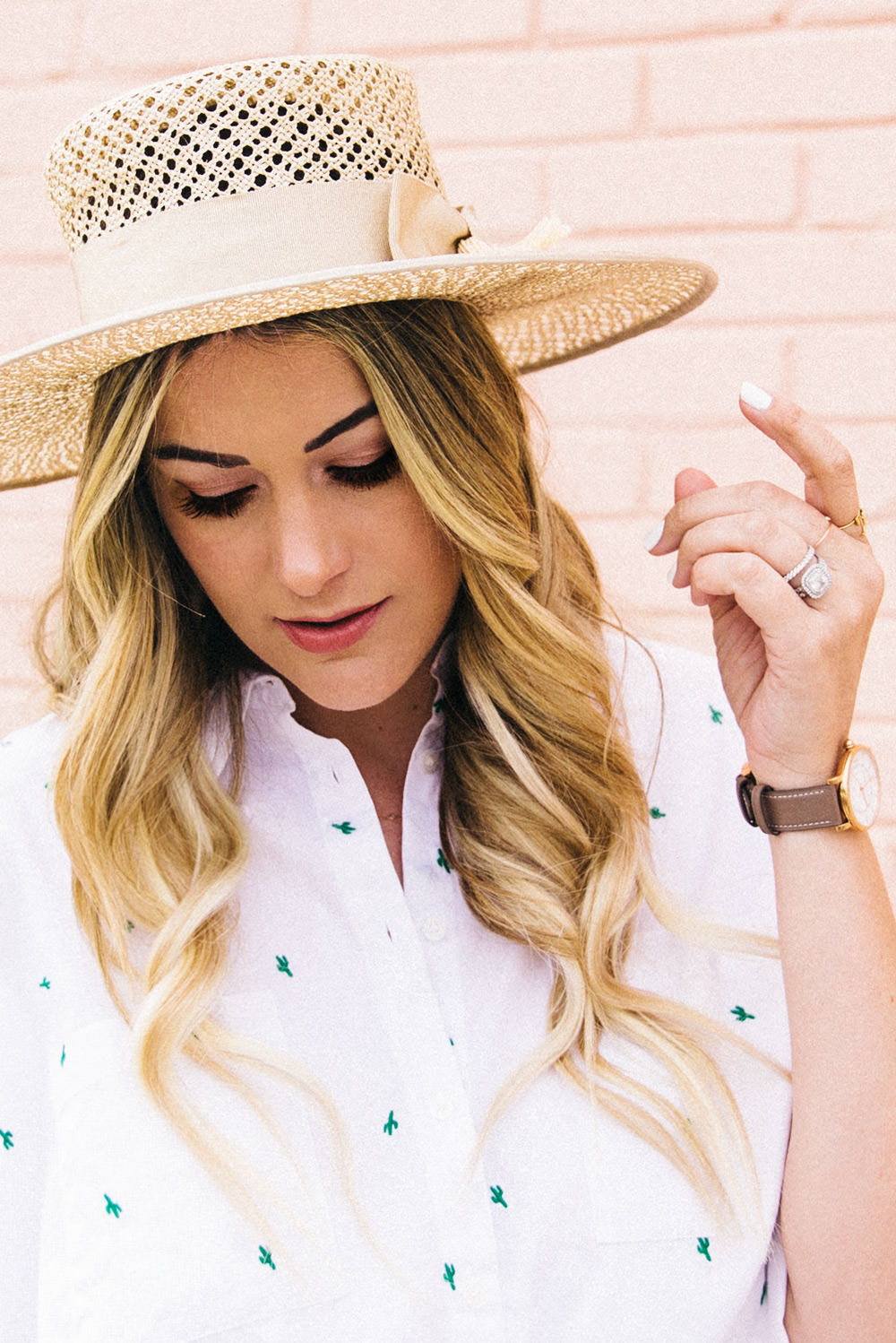 Caitlin Lindquist of Dash of Darling shares an all white outfit for Spring with a cactus shirt and a boater hat.