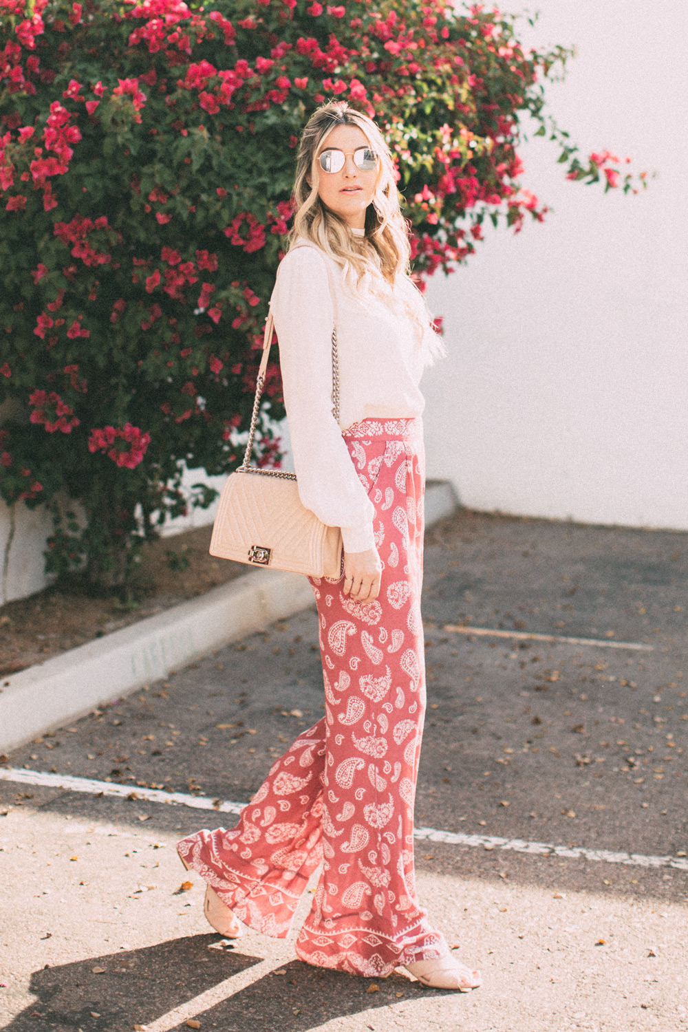 Caitlin Lindquist of the Arizona fashion blog Dash of Darling shares how to style pink high waisted paisley pants for spring