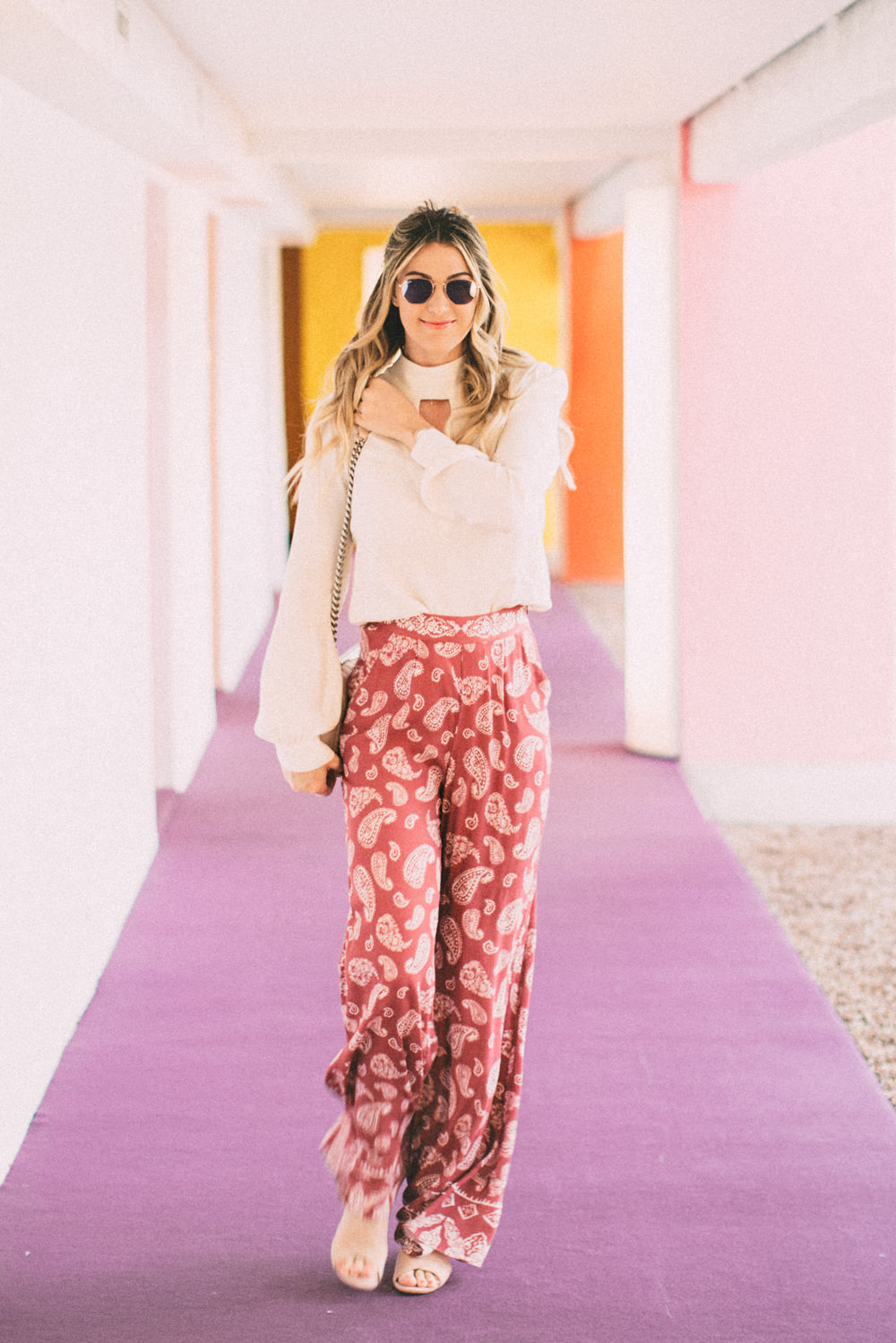 Caitlin Lindquist of the Arizona fashion blog Dash of Darling shares how to style pink high waisted paisley pants for spring