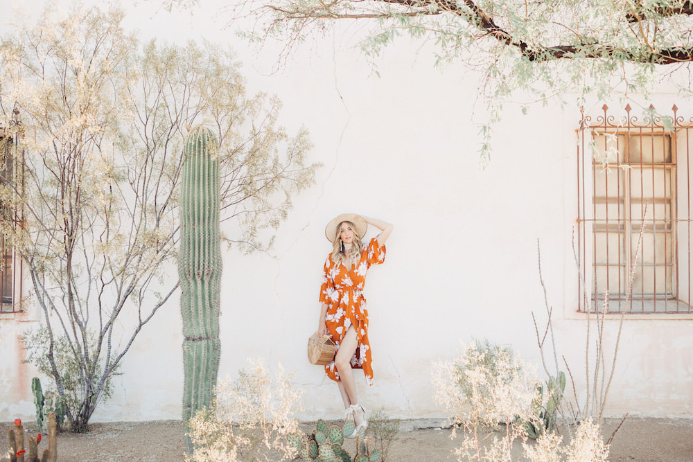 Caitlin Lindquist of the Arizona fashion blog Dash of Darling shares a summer outfit in an orange rust Rue Stiic kimono wrap dress and Preston and Olivia hat.