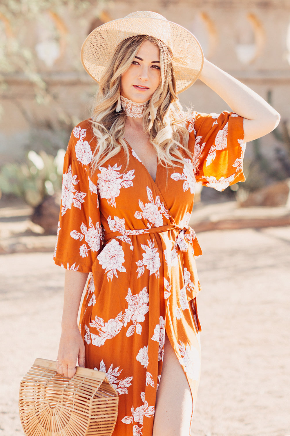 Caitlin Lindquist of the Arizona fashion blog Dash of Darling shares a summer outfit in an orange rust Rue Stiic kimono wrap dress and Preston and Olivia hat.