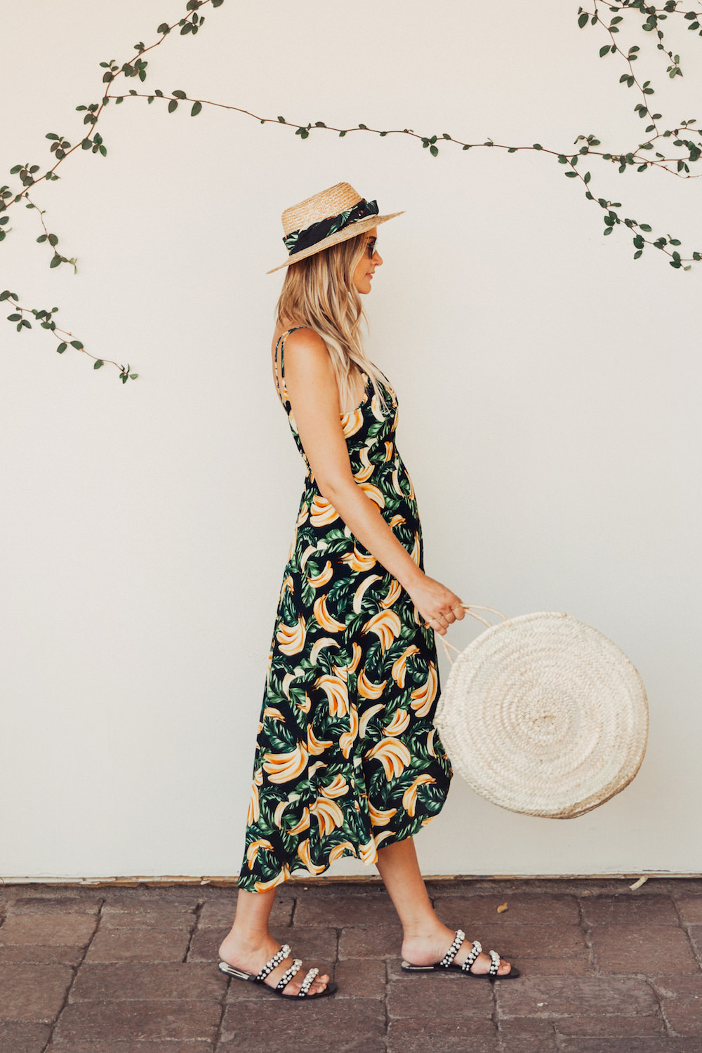 Dash of Darling wears a Show me Your Mumu wrap dress in Gone Bananas for Summer in a giveaway post.