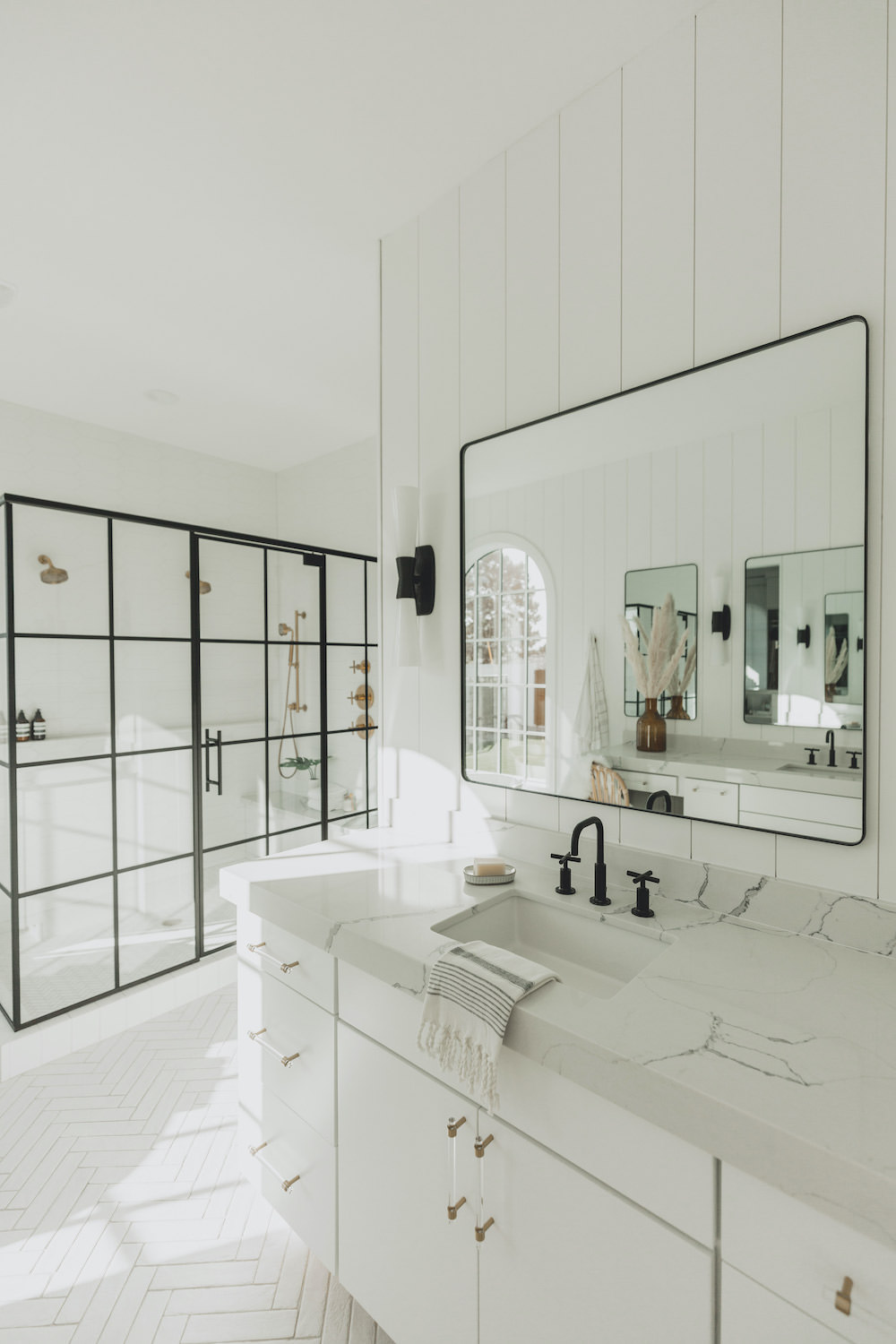 Dash of Darling | Modern Bohemian Bright White Master Bathroom Black Grid Shower